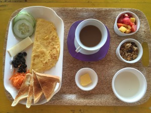 Breakfast of Champions! Plain yogurt, extraordinary granola and fresh fruit. Egg omelette, veggies, toast and coffee. 