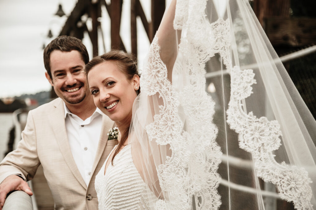 Safe wedding during covid-19, keep it outdoors, socially distancing for fun. Photography by Kathryn Parrott. His suit by TOPShop, her dress by David's Bridal. Veil imported from St. Petersburg, Russia.